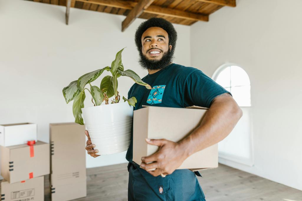 professional movers carrying boxes — packing tips for moving
